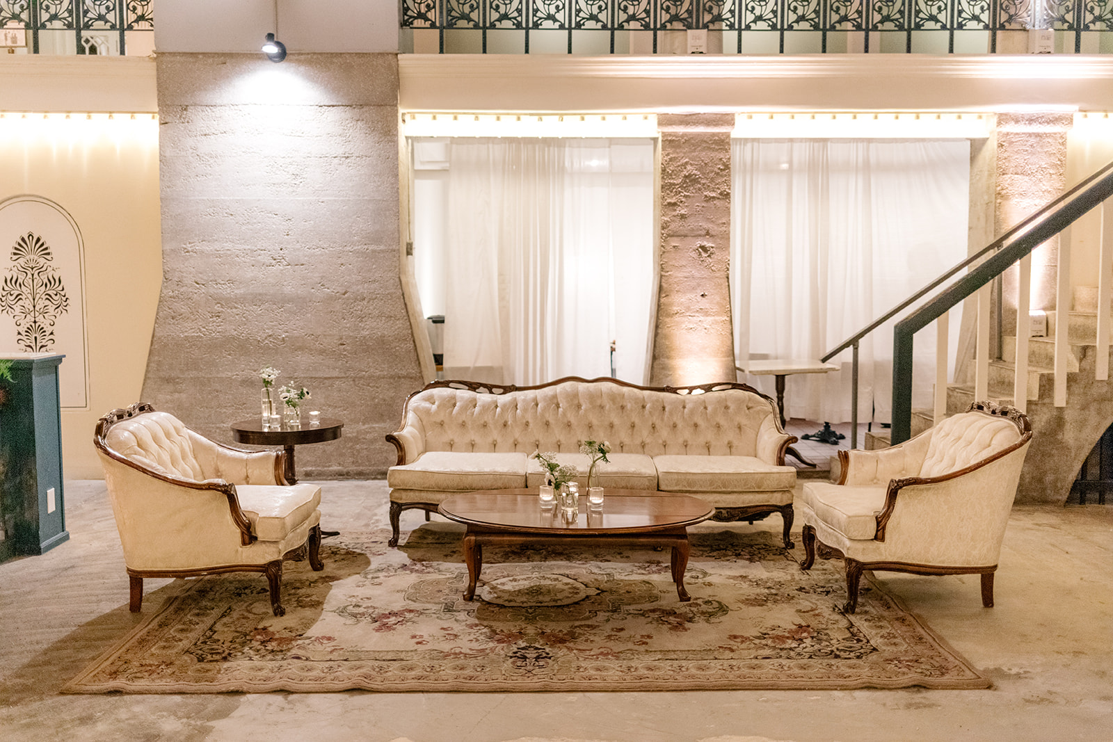 Ribault lounge group featuting ivory fabric and wood accents, available for wedding, party and event rentals.